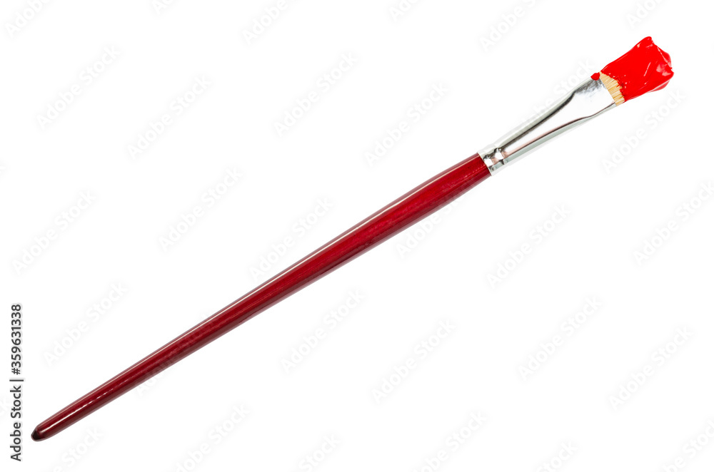 flat paint brush with red colored tip in blot and brown handle isolated on white background flat paint brush with red colored tip in blot and brown handle isolated on white background