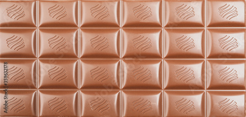 Different chocolate bars on whole background. Sweet food