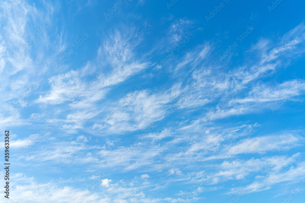 White clouds on blue sky. Abstract natural background. Atmospheric phenomenon. White clouds on blue sky. Abstract natural background. Atmospheric phenomenon.