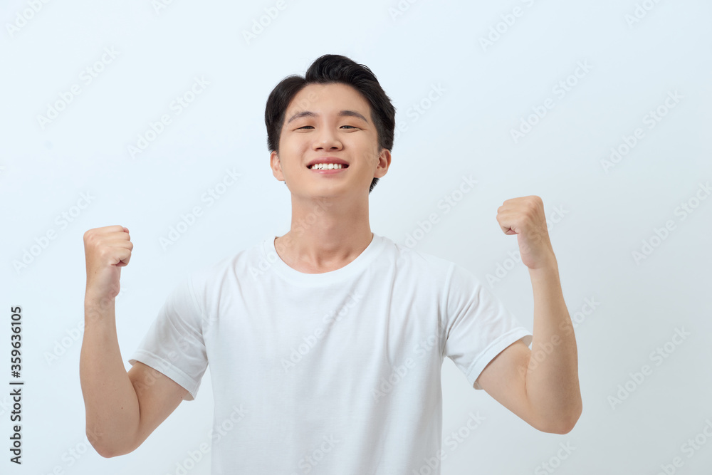 Happy winner. Happy young handsome man gesturing and keeping mouth open while standing against white background Happy winner. Happy young handsome man gesturing and keeping mouth open while standing against white background