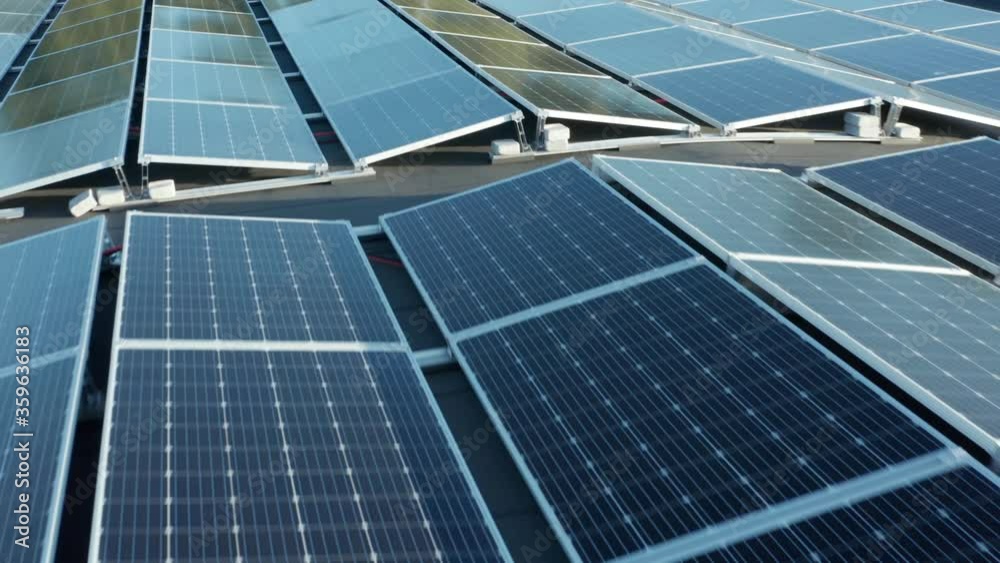 Close up aerial view of mounted solar panel array, modern photovoltaic energy modules system
