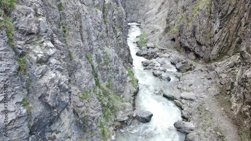 Aerial shot of a stormy river in a gorge / canyon photo