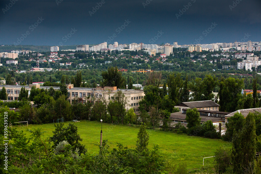 Chisinau, the capital city of the Republic of Moldova. Storm clouds over city. Cloud over the city at the sunset. Chisinau, the capital city of the Republic of Moldova. Storm clouds over city. Cloud over the city at the sunset.