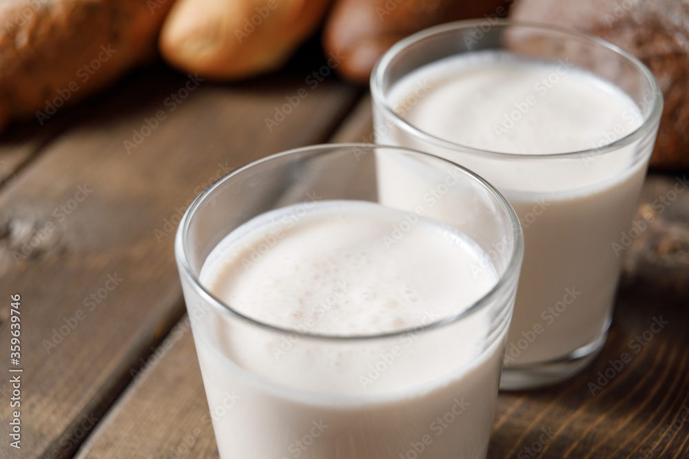 Probiotic cold fermented dairy drink kefir on wooden background. Probiotic cold fermented dairy drink kefir on wooden background.