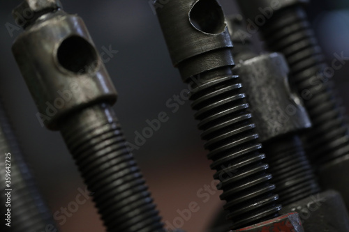Close up of spare parts of vehicles on a dark background. Auto service and machinery concept