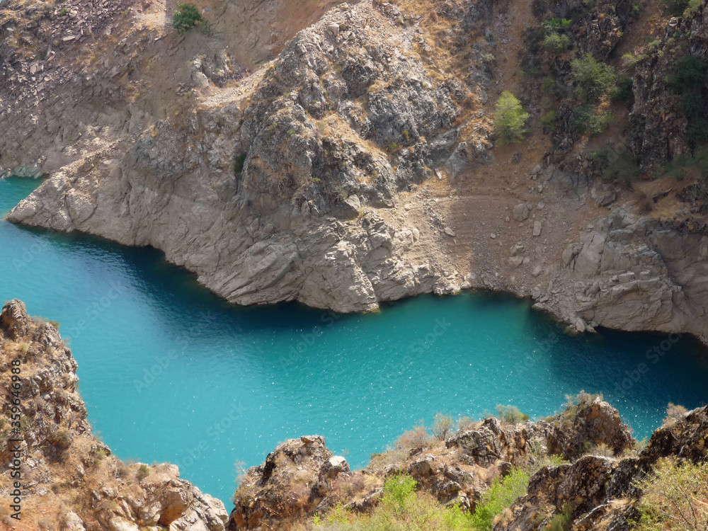 Located in the mountains of Uzbekistan, lake Charvak with clear blue water.