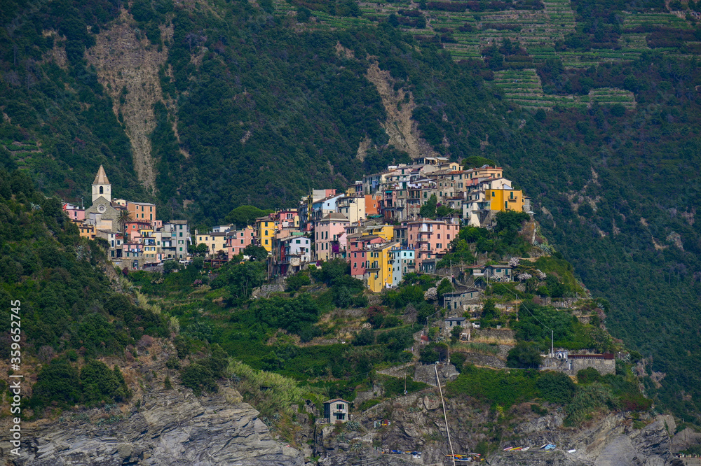 Obraz premium Corniglia, a Cinque Terra mountain village and tourist attraction on the steep coast of the Mediterranean sea in Liguria, Italy