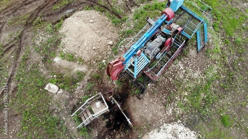 Oil pump jack rocking. Rocking machines for power generation. Extraction of oil. Aerial view.