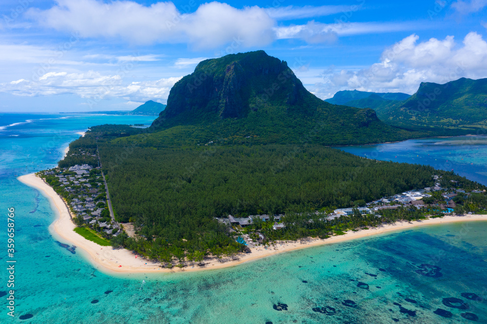Aerial view of Le Morne Brabant, a UNESCO world heritage site.Coral reef of the island of Mauritius. panorama underwater waterfall