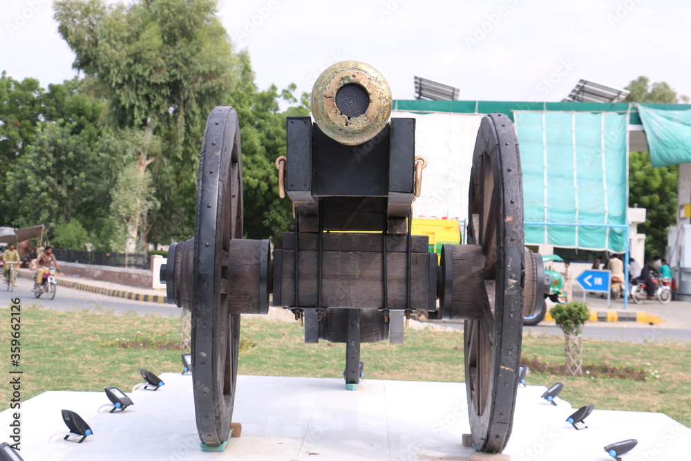 Nawab of Bahawalpur cannon on wheels for war, Castle cannon for defend. Ancient Gun Barrel of the castle. Antique cannons on gun carriage. Gun Barrel.Old cannon large. Ancient black cannon. Black old Nawab of Bahawalpur cannon on wheels for war, Castle cannon for defend. Ancient Gun Barrel of the castle. Antique cannons on gun carriage. Gun Barrel.Old cannon large. Ancient black cannon. Black old