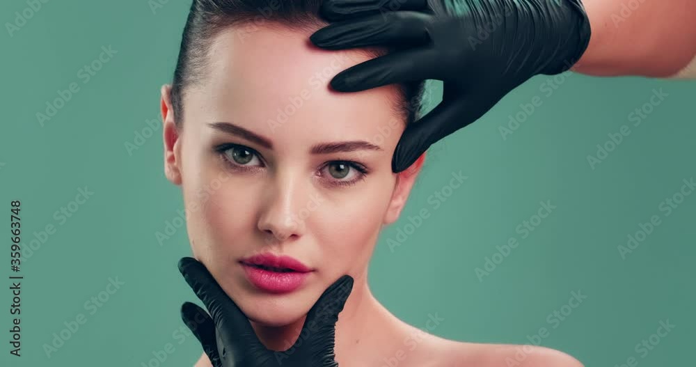 Vidéo Stock Slow motion clip Doctor checks a skin before plastic