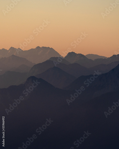 layers of mountains during sunrise