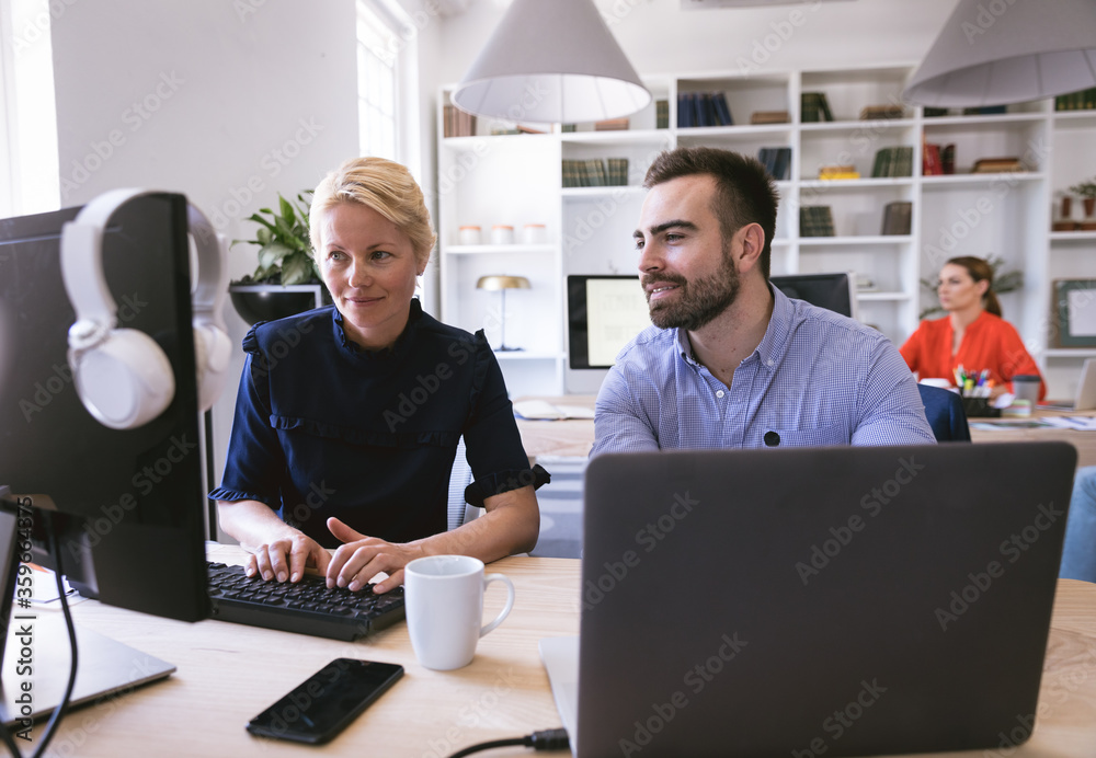 Caucasian businesspeople exchanging in a workspace Caucasian businesspeople exchanging in a workspace