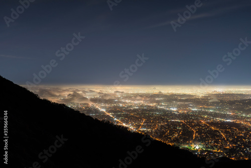 Foggy night mountaintop vie...