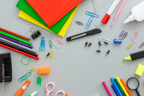 Material for school, paper clips, pencils, colors, scisor and notebook