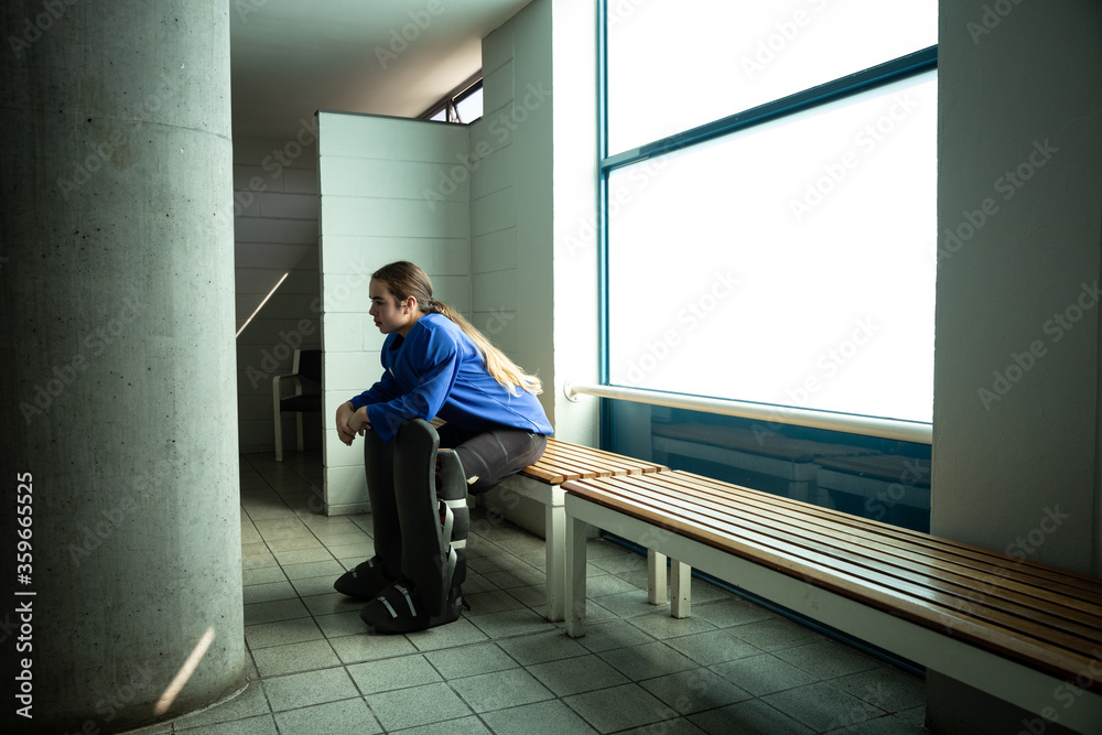 Female hockey player in a cloakroom Female hockey player in a cloakroom
