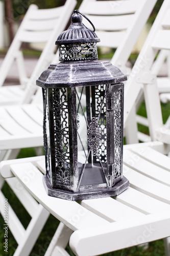 Black vintage iron decorative lantern on grass