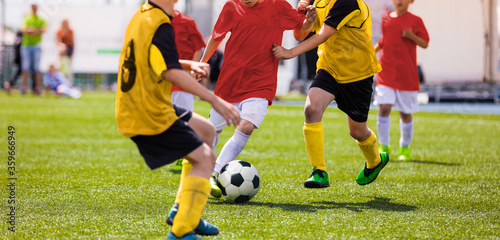 Fototapeta Naklejka Na Ścianę i Meble -  Kids Play Soccer Game. Children Outdoor Football Tournament Match on Grass Field