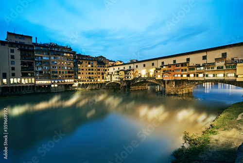 The Medieval stone 'Ponte Vecchio' bridge spanning the River Arno at night