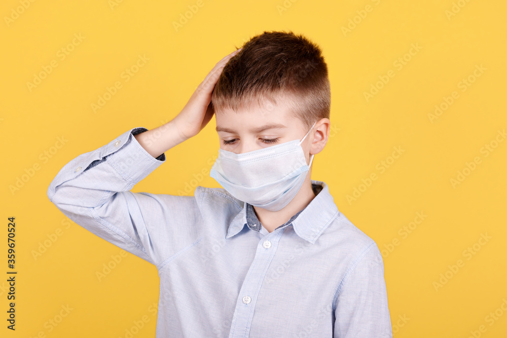Portrait of a brunette boy with headache in medical mask. Portrait of a brunette boy with headache in medical mask.