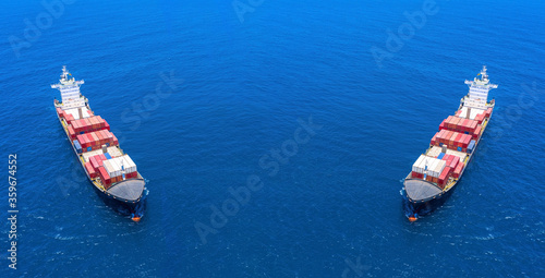 Two Container Ships anchored at sea, Aerial image. photo