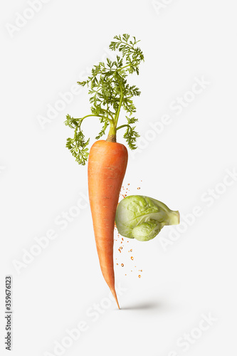 Canvas Print Natural cabbage as a boxing glove is punching carrot vegetable.