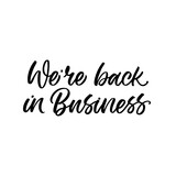 Hand lettered quote. The inscription: We're back in business.Perfect design for greeting cards, posters, T-shirts, banners, print invitations.