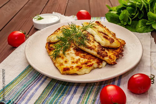 Hot appetizer - pita bread with cheese and herbs. Vegetarian healthy food