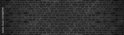 Dark black painted brick stone masonry wall texture background wallpaper panorama banner