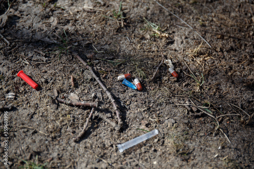 Wallpaper Mural used broken medical needle, cap and pills lie on the ground Torontodigital.ca