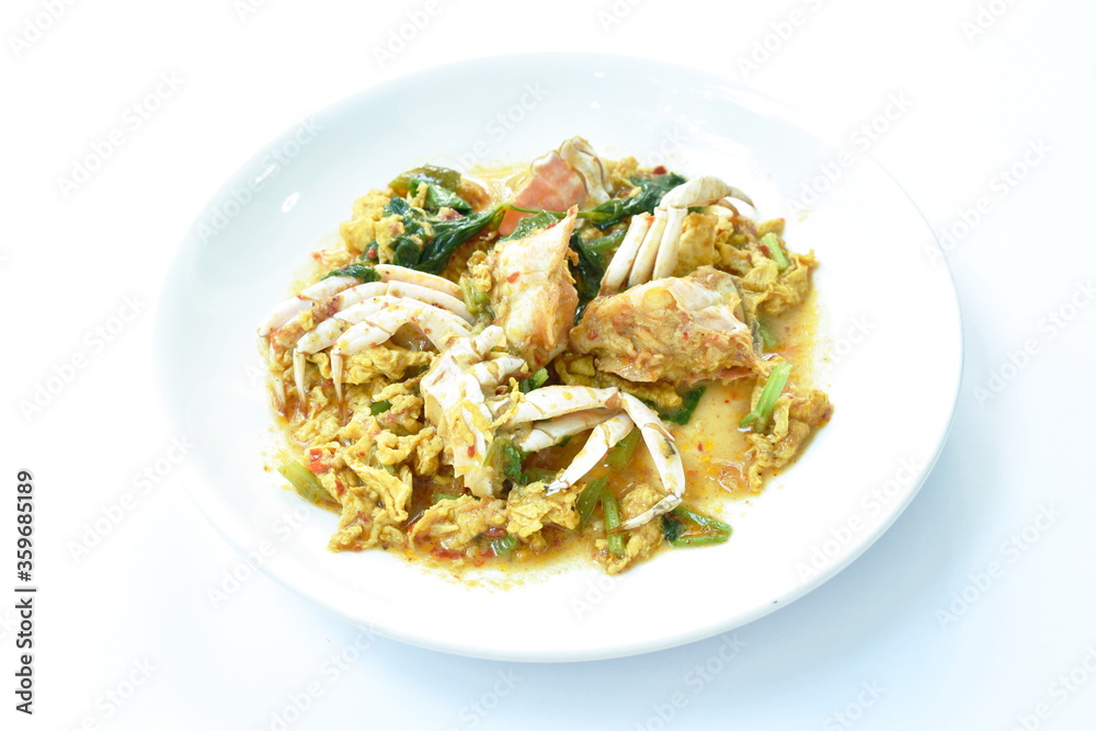 stir fried swimmer crab in yellow curry and egg on plate stir fried swimmer crab in yellow curry and egg on plate