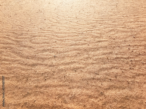 Dry ground texture with exotic wave characteristics caused by wind blowing in the top view photo