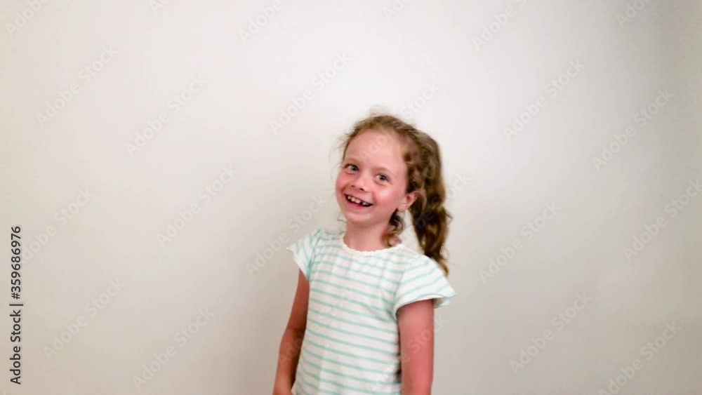 Cute little girl shows her funny emotions. Artistic child having fun on camera. Cute little girl shows her funny emotions. Artistic child having fun on camera.