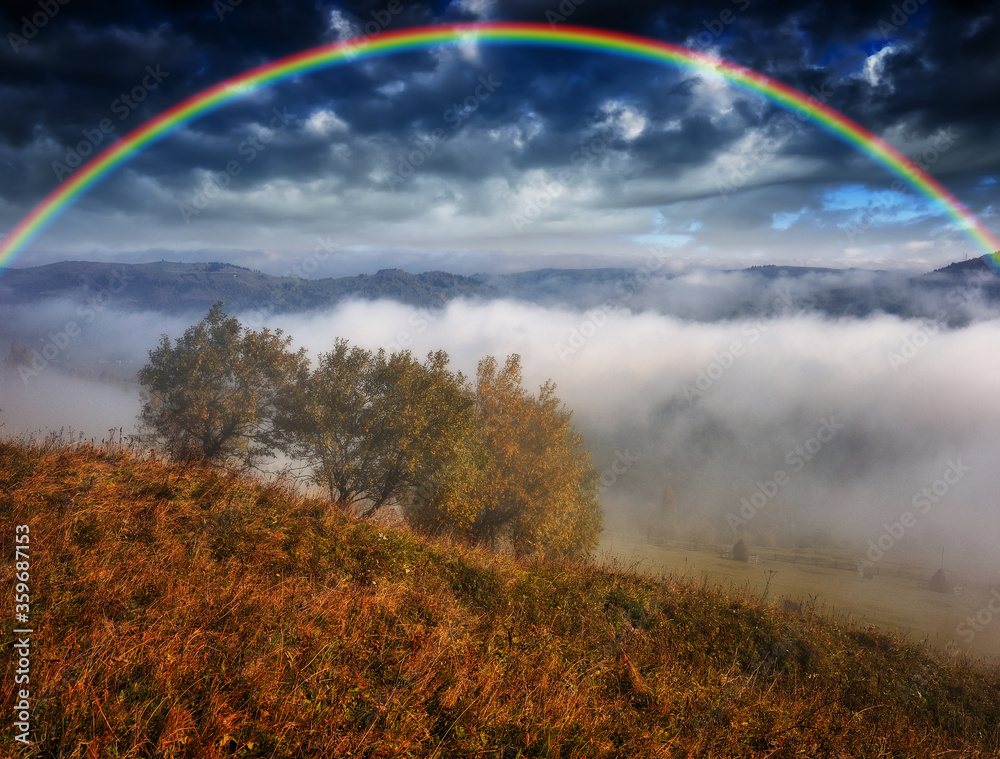 Rainbow over the Mountains. autumn morning in the Carpathians Rainbow over the Mountains. autumn morning in the Carpathians