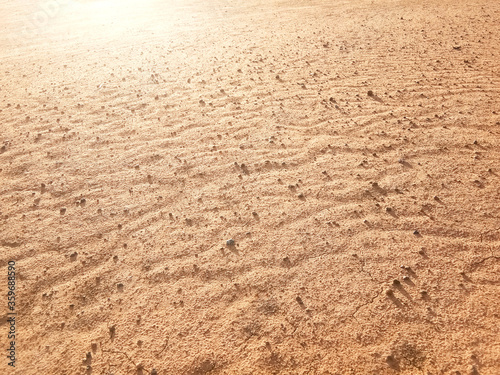 Dry ground texture with exotic wave characteristics caused by wind blowing in the top view photo