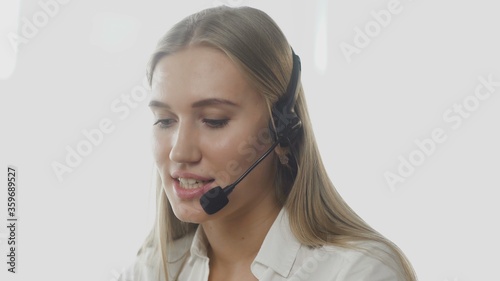 Technical support specialist talking with customer by headset
