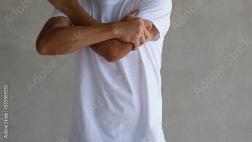 A man asian with arm pain