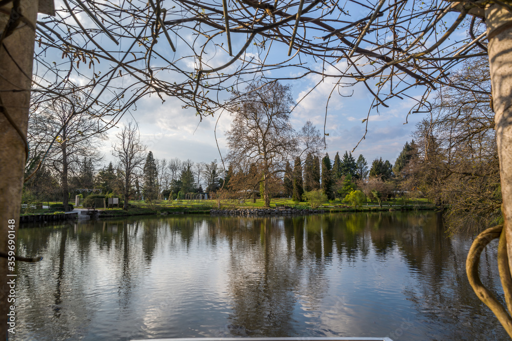 Panoramic view of Arboretum Volčji Potok, Slovenia. Public park extending over 85 hectares with beautiful ponds. Reflection in water of colorful trees in autumn season Panoramic view of Arboretum Volčji Potok, Slovenia. Public park extending over 85 hectares with beautiful ponds. Reflection in water of colorful trees in autumn season