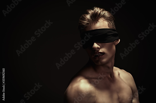 naked guy with blindfold photo