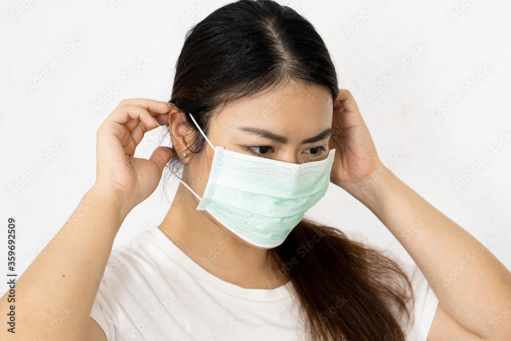 portrait woman waring mask for protect corona virus on white background. portrait woman waring mask for protect corona virus on white background.