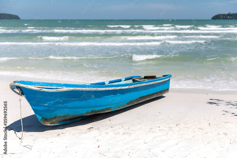 Naklejka premium Boat on the beach, saracen bay beach, koh rong samloem island, sihanoukville, Cambodia.