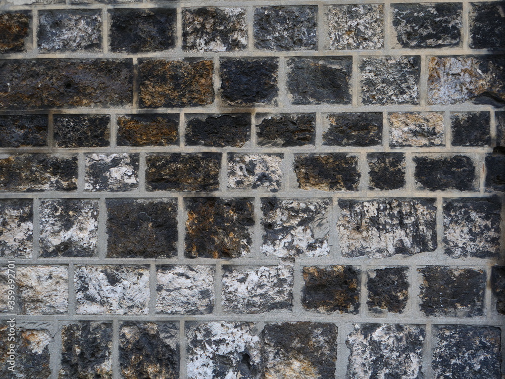 A stone of wall of the cemetory Père Lachaise in Paris. A stone of wall of the cemetory Père Lachaise in Paris.