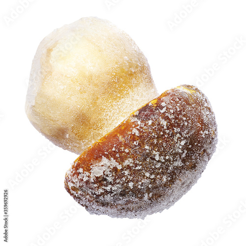 Frozen white mushroom on a white background. Isolated frozen mushroom.  