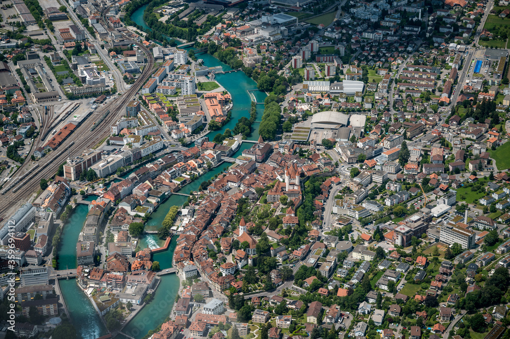aerial view of the city center of Thun with Schloss Thun, Aare and Bälliz  seen from the Helicopter