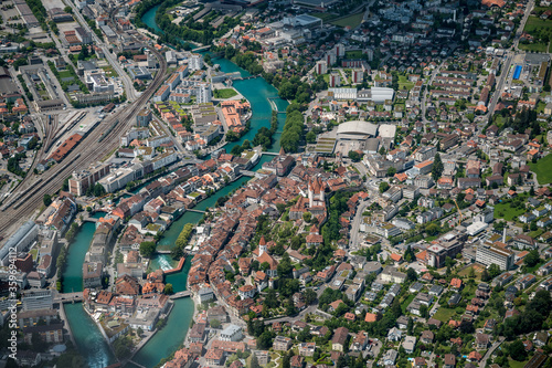aerial view of the city center of Thun with Schloss Thun, Aare and Bälliz seen from the Helicopter