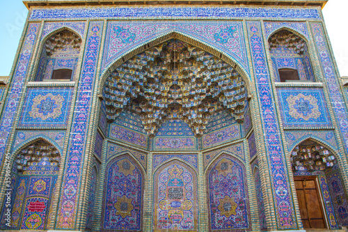 Famous pink mosque decorated with mosaic tiles and religious calligraphic scripts from Persian Islamic Quran  Shiraz  Iran. 