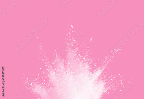 White powder explosion isolated pink background.