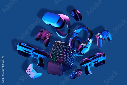 Canvas Print Virtual reality gogles, gamepads and blaster game controllers, games keyboard, mouse and headset