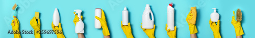 Hands in gloves holding detergent bottles on blue background. Banner with copy space. Chemical cleaning products, household chemicals, brushes and supplies collage. Cleaning service concept