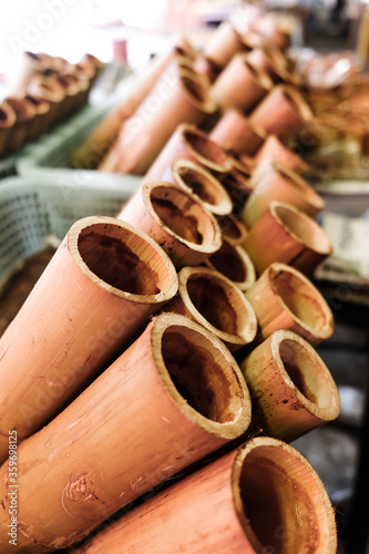 glutinous rice roasted in bamboo joints,Traditional Thai food © ponsulak